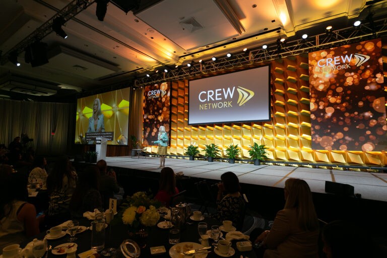 CREW Network female speaker on stage
